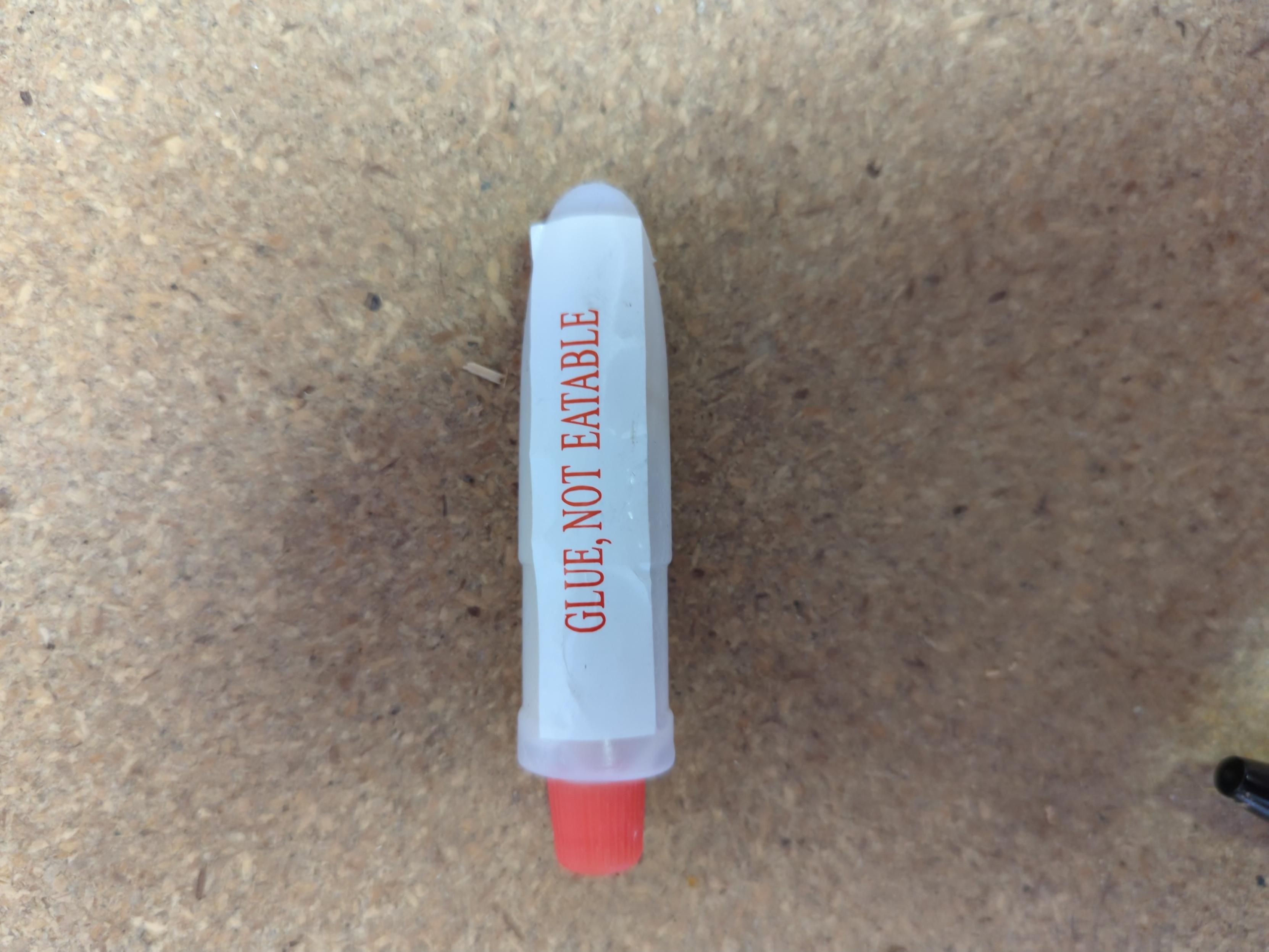 Tube of glue with the words 