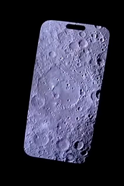 Screenshot of Reid Wiseman showing his phone with a photo of the moon to the live stream camera onboard Artemis II